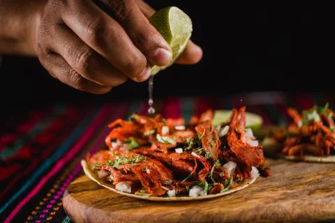 Close-up of a lime being squeezed in a mexican taco Stock Photos