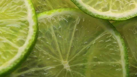 Close up of lime slices, rotation in circle. lime green Turning. Stock Footage 234897655