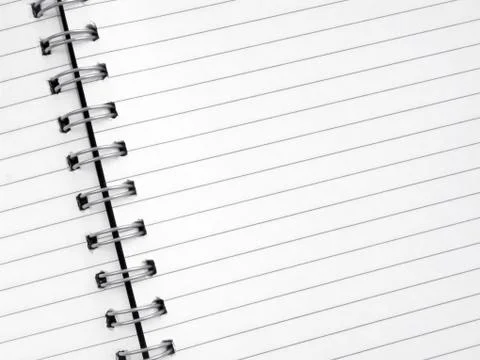 Close up of lined paper in a spiral notepad. Stockfoto's