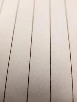 Close up of lined writing white paper studio macro Foto stock