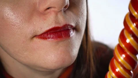 Close-up, lips with bright red lipstick. A charming European adult woman 35-4 Stock Footage 84769176