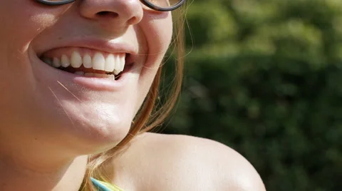 Close up on lips of a woman in conversation, in slow motion Stock Footage