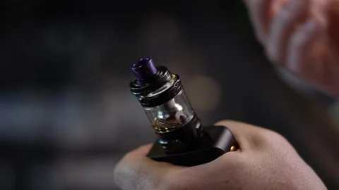 Close-up of liquid getting poured into a vape atomizer for smoking Video stock 120006552