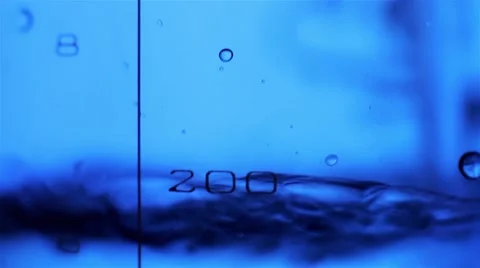 Close-up of liquid in a measuring beaker is poured in the laboratory Stock-Footage 45202869
