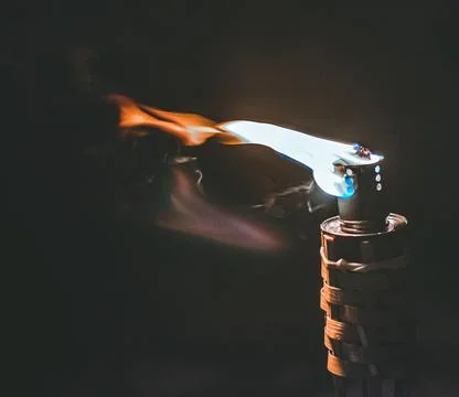 Close-up of a lit torch at night Stock Photos