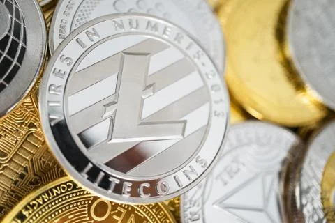 Close-up of litecoin physical coin on stack of many other cryptocurrencies Stock Photos
