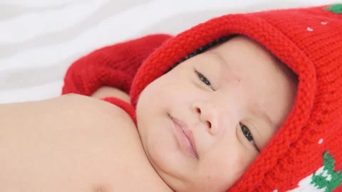 Close up little baby girl lying on the bed. Stock Footage 242740887