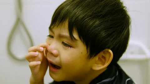 Close-up of a little boy crying while si... | Stock Video | Pond5
