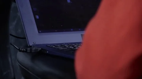 Close up of a little boy sitting on the floor and trying to learn with a Stock Footage 75347698