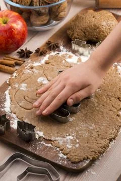 Close up little hands making the gingerbread cookies Stock Photos