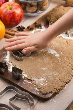 Close up little hands making the gingerbread cookies Stock Photos