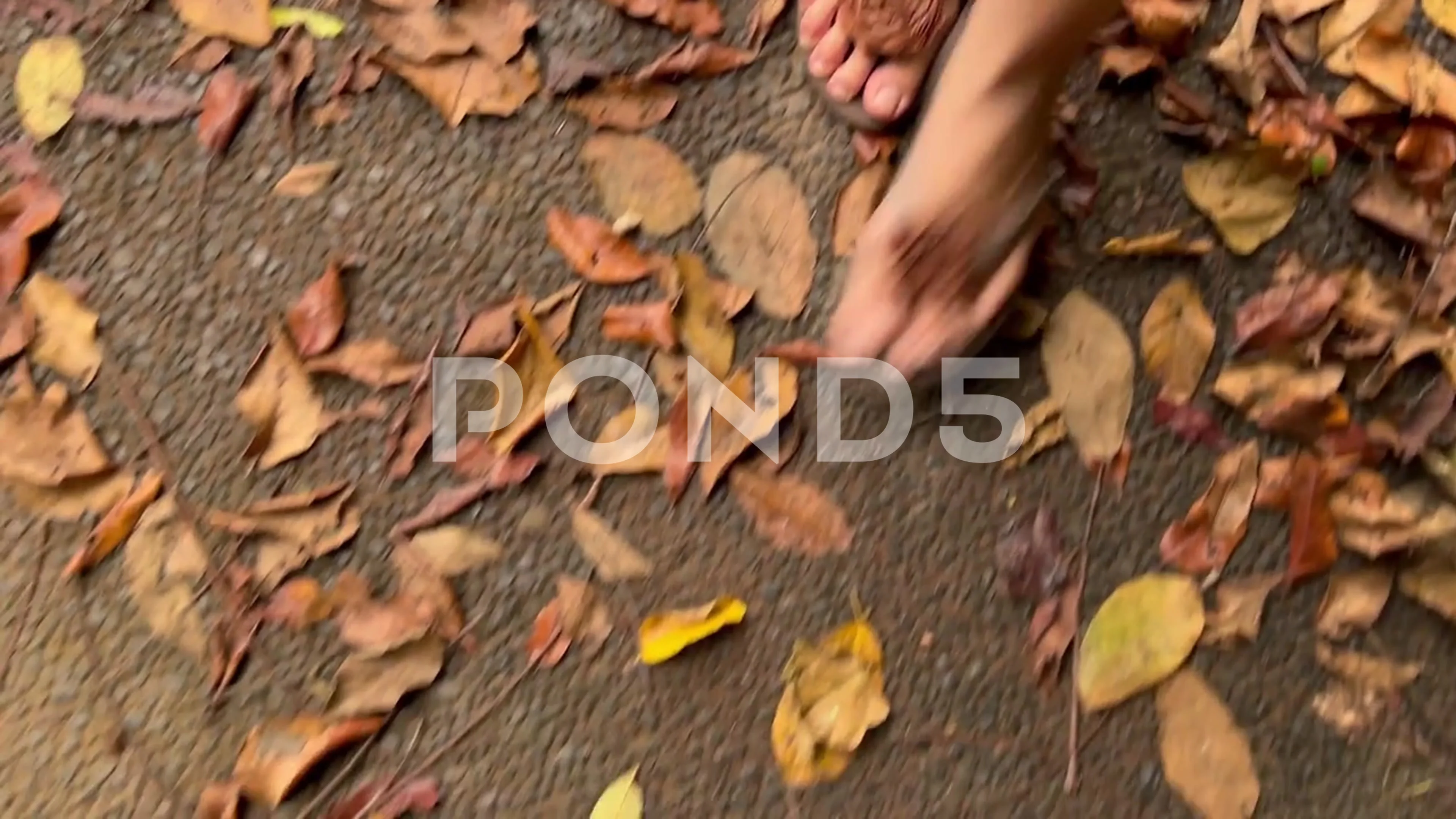 Close-up live camera view of female feet wearing flip-flops stepping on the