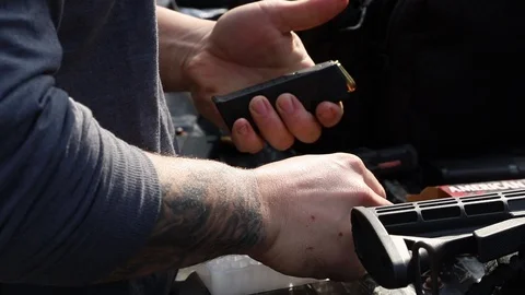 Close Up Loading Bullets Into Magazine For Gun Stock Footage 125540360