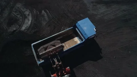 Close-up loading trucks with coal ore. The drone hovered over a heavy dump truck Stock Footage 169589810