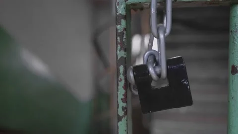 Close-up of lock on chain hanging Stock Footage 201311717