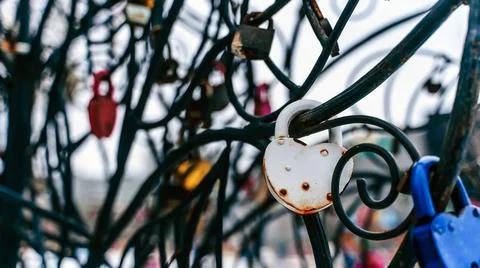 Close up of lock on iron construction. Locks of love its romantic tradition o Stock Photos