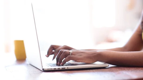 Close-up lockdown shot of hands of female blogger using laptop Stock Footage 114859672