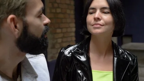 Close-up lockdown shot of two young people talking to each other at club Stock-Footage 114874886