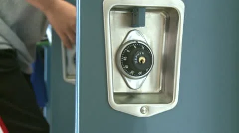Close up of locker combination and student kicking locker closed Stock Footage 8978942