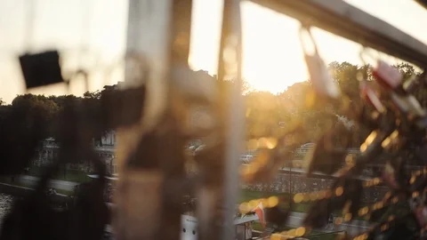 Close up of the locks of lovers on the bridge with a beautiful view little town Stock Footage 95448690