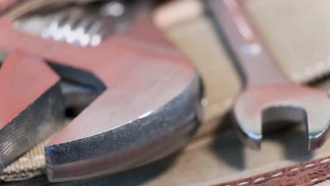 Close-up of locksmith's tool - adjustable wrenches in a canvas bag pocket Stock-Footage 139534134