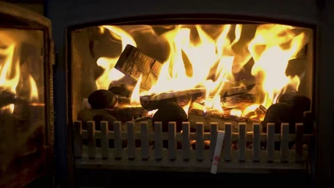 Close up of log burner with door open, focus on wood. Stock Footage 142478332