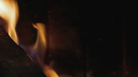 Close up of log burning in fireplace dolly shot Stock Footage 148960656