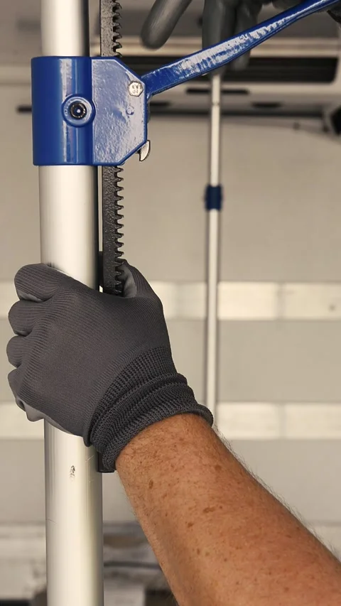 Close up of a logistics worker hands locking a cargo safety barrier pole Vídeo Stock 341825224