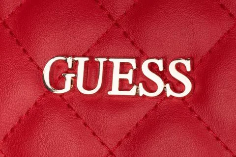 Close-up of the logo of GUESS, the handbag and clothing manufacturer. Logotyp Stock Photos