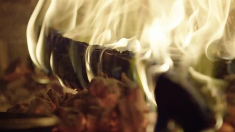 Close up of logs on fire and coals in wood fired oven RED 4K slowmo Stock Footage 117534394