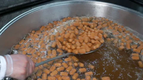 Close-up of Lokma balls being deep fried making traditional turkish sweet pastry Stock-Footage 227349237