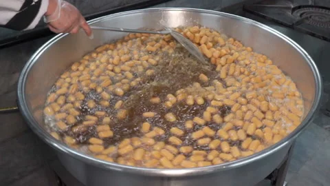 Close-up of Lokma balls being deep fried making traditional turkish sweet pastry Stock-Footage 227349612