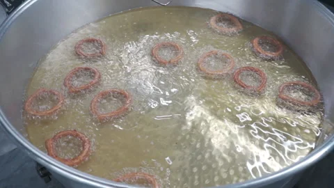 Close-up of Lokma balls being deep fried making traditional turkish sweet pastry Stock-Footage 227350229