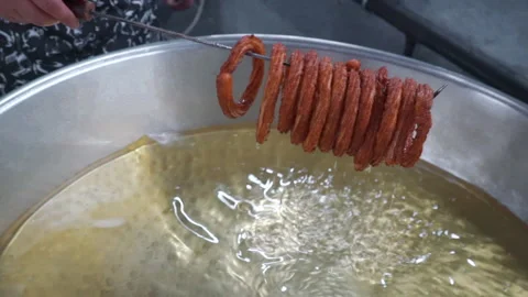 Close-up of Lokma balls being deep fried making traditional turkish sweet pastry Stock-Footage 227350308