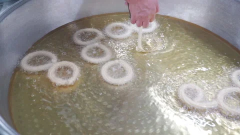 Close-up of Lokma balls being deep fried making traditional turkish sweet pastry Stock-Footage 227426190