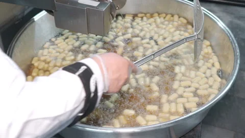 Close-up of Lokma balls being deep fried making traditional turkish sweet pastry Stock-Footage 227427060