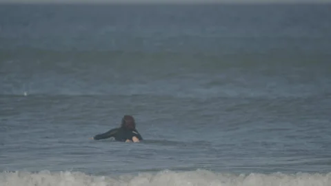 Close-up lone surfer with big waves Stock Footage 345717667
