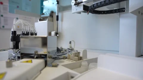Close-up of a Long sharp laboratory needle moving fast on an modern Video stock 245403750