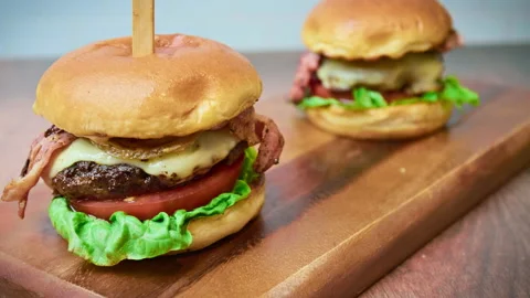 Close-up look of a beef burger in 4K in slow-motion. Stock Footage 153762284
