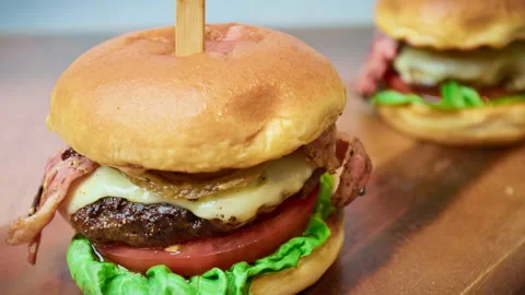 Close-up look of a beef burger in 4K in slow-motion. Stock Footage 153762295