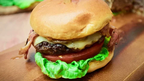 Close-up look of a beef burger in 4K in slow-motion. Stock Footage 153820952
