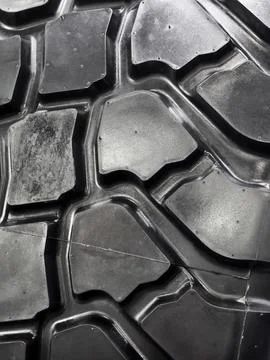 Close look at the detailed pattern of an off-road tire showing unique tread.. Stock Photos