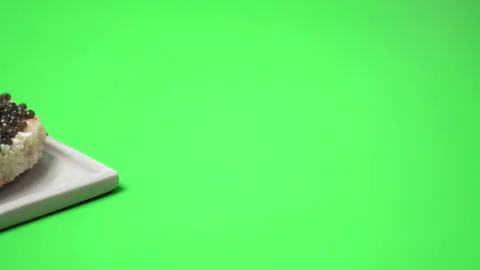 A close-up look of freshly made Caviar sandwich on a green background in 4K. Stock Footage 149618672