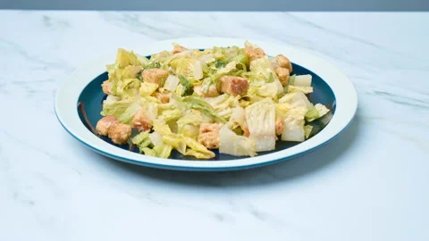 A close-up look at a freshly made green healthy Caesar Salad in 4K. Stock Footage 140769710