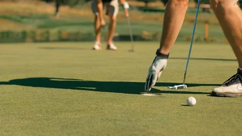 Close look of hole with putt in and set up Stock-Footage 104298942
