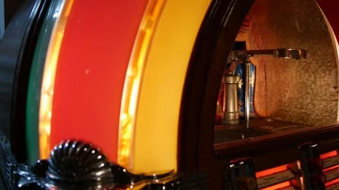 Close-up look inside an antique record playing jukebox Stock Footage 97856177