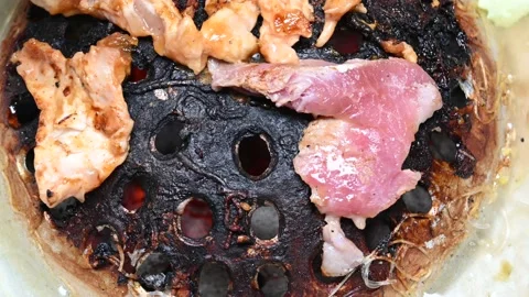Close look at Korean BBQ Flipping Meat Stock Footage 134995763