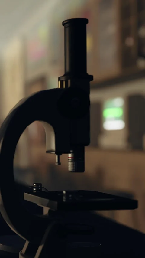Close look at microscope with blurred background in classroom setting Stock Footage 341266250