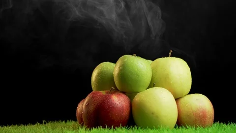 Close look of pile of red,green and yellow apples on green rotating surface,4k Stock Footage 113055475