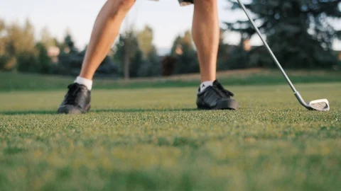 Close look of player swinging on green Stock Footage 104298931
